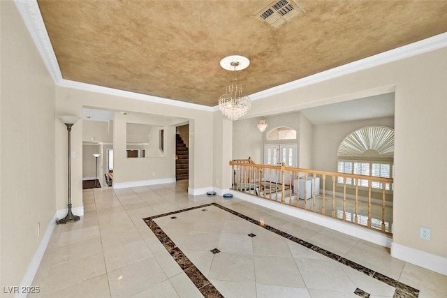 hallway featuring a raised ceiling, crown molding, tile patterned flooring, and an inviting chandelier