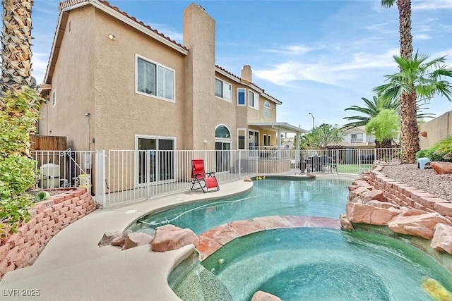 view of pool featuring an in ground hot tub and a patio area