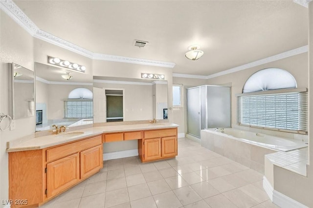 bathroom with crown molding, tile patterned floors, independent shower and bath, and vanity