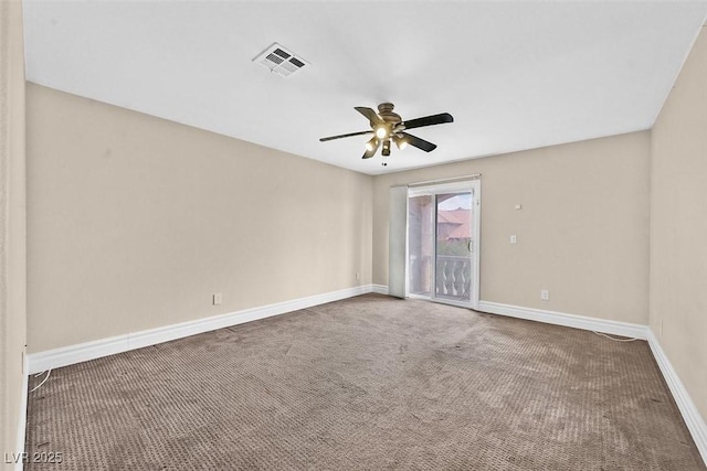 spare room with carpet and ceiling fan