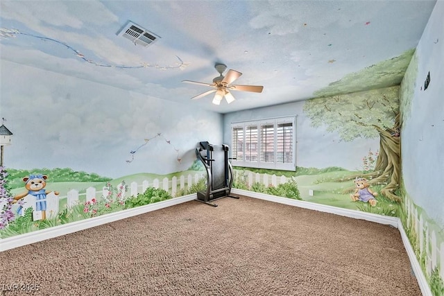 workout area featuring carpet floors and ceiling fan