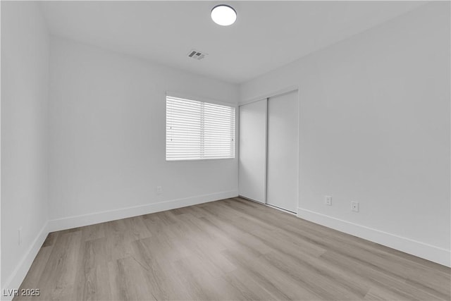 unfurnished room featuring light hardwood / wood-style flooring