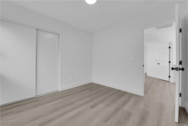 unfurnished bedroom with light hardwood / wood-style flooring