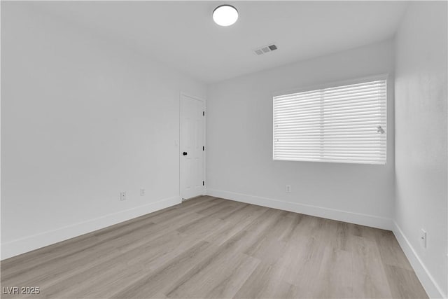 empty room with light hardwood / wood-style floors