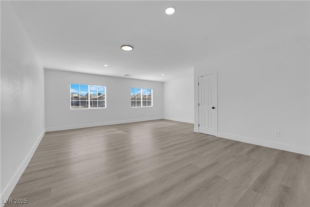 empty room with light wood-type flooring