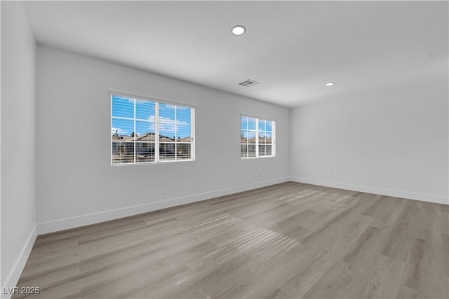 unfurnished room featuring light wood-type flooring