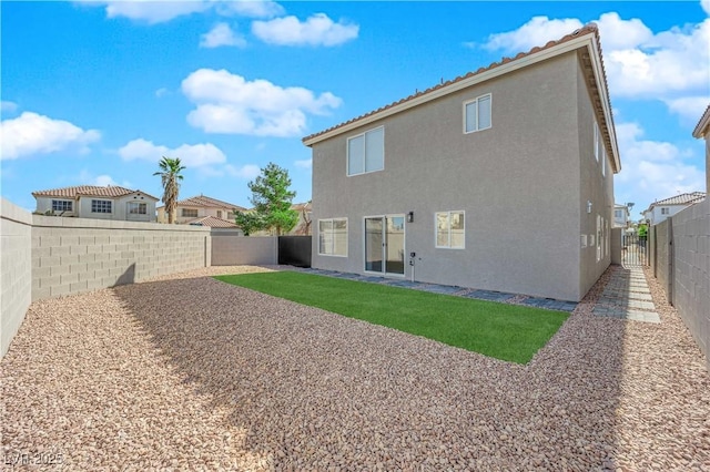 back of property featuring a patio