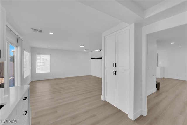 spare room featuring light hardwood / wood-style floors