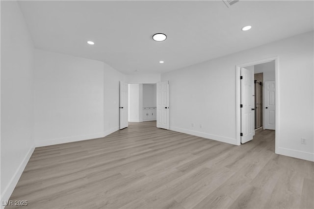 empty room with light hardwood / wood-style floors