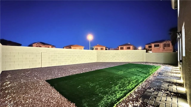 view of yard at night