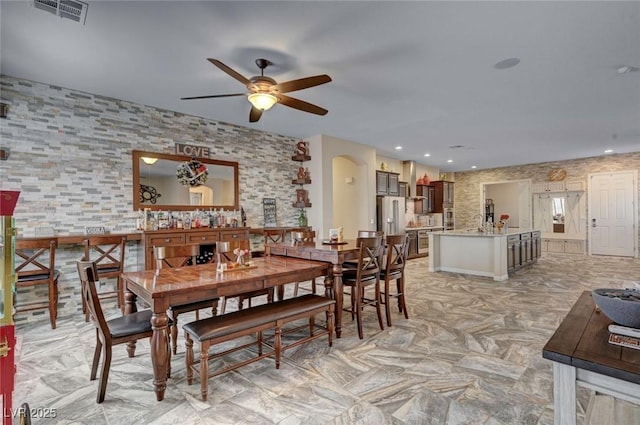 dining area with ceiling fan