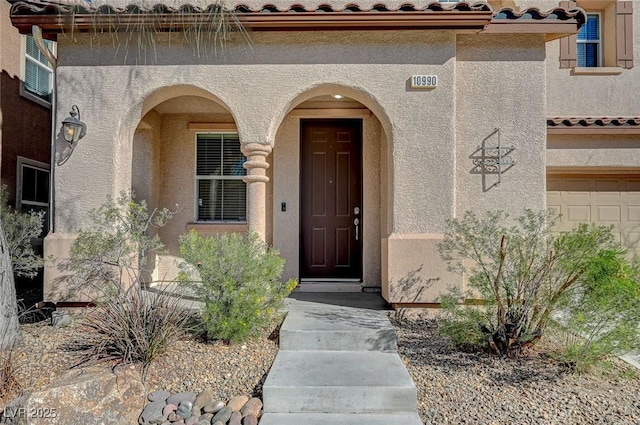 property entrance featuring a garage