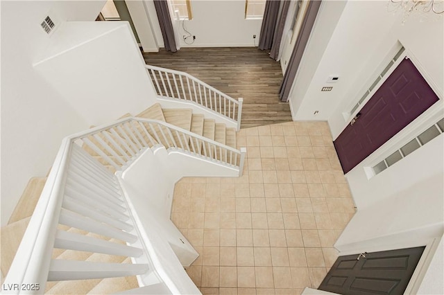 staircase featuring hardwood / wood-style flooring