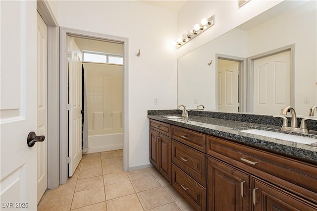 bathroom with shower / bath combination, vanity, and tile patterned floors