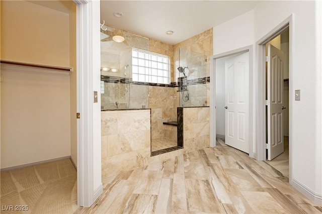 bathroom with tiled shower