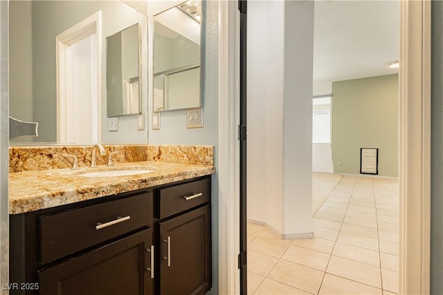 bathroom featuring tile patterned floors and vanity