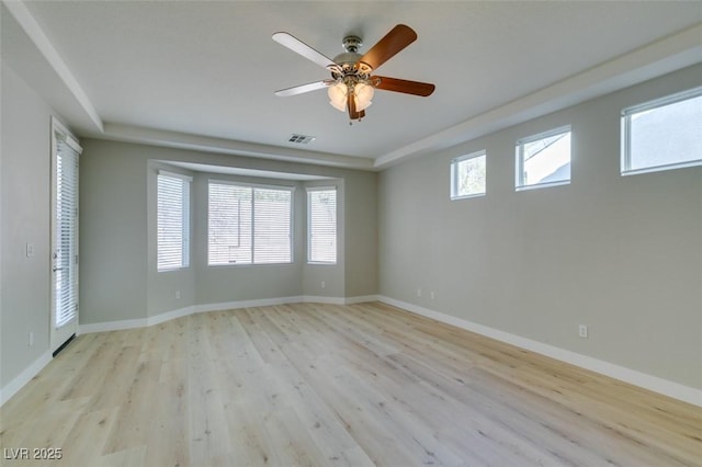 unfurnished room with ceiling fan and light wood-type flooring