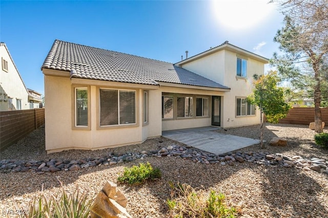 back of property featuring a patio