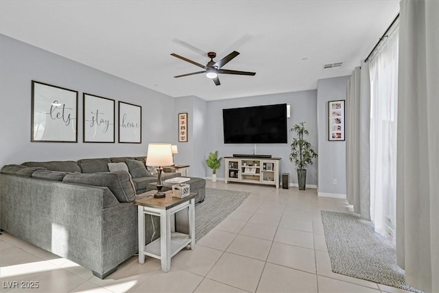 living room featuring ceiling fan and light tile patterned floors