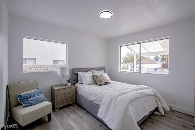 bedroom featuring light wood-type flooring