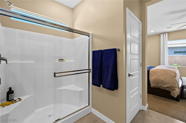 bathroom featuring a shower with shower door and tile patterned floors