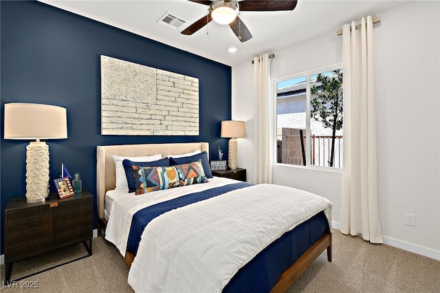 bedroom with ceiling fan and carpet