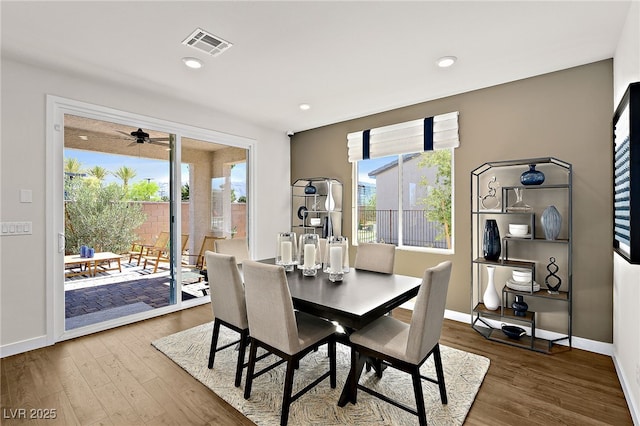 dining room with a healthy amount of sunlight and hardwood / wood-style floors