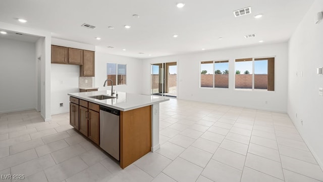 4485 E Brusca Way, Pahrump, NV 89061 - kitchen with light countertops, stainless steel dishwasher, visible vents, and a sink