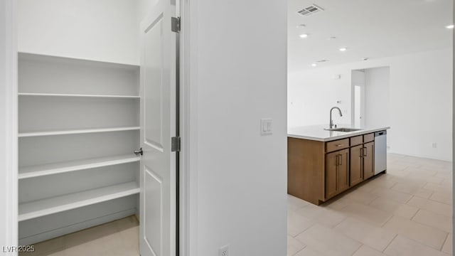 4485 E Brusca Way, Pahrump, NV 89061 - bar with stainless steel dishwasher, a sink, light tile patterned flooring, visible vents, and recessed lighting