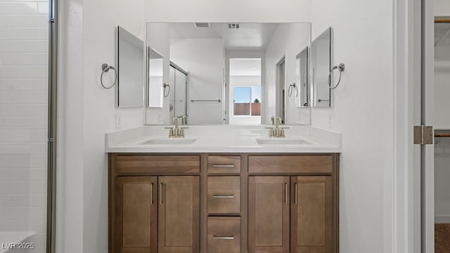4485 E Brusca Way, Pahrump, NV 89061 - bathroom featuring an enclosed shower, a sink, double vanity, and visible vents