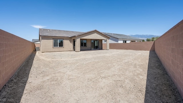 4485 E Brusca Way, Pahrump, NV 89061 - back of house featuring a fenced backyard and stucco siding