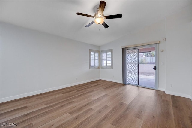 unfurnished room featuring ceiling fan, lofted ceiling, and light hardwood / wood-style floors