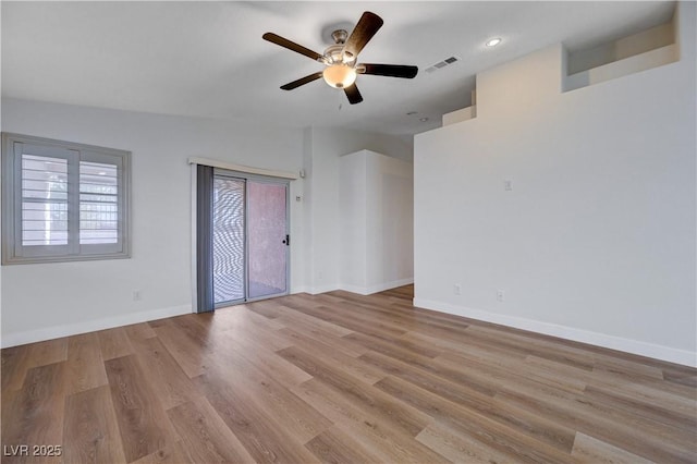 unfurnished room featuring light hardwood / wood-style flooring and ceiling fan