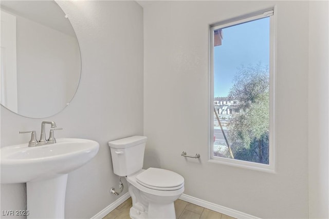 bathroom featuring sink, wood-type flooring, and toilet