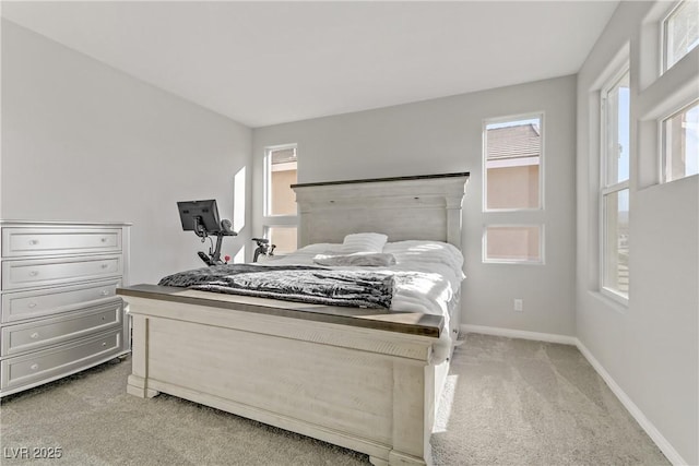 carpeted bedroom featuring multiple windows