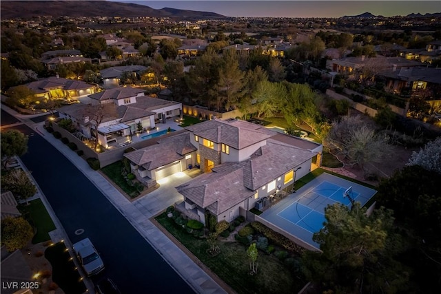 birds eye view of property with a mountain view