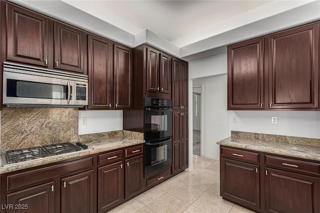 kitchen featuring backsplash, stainless steel appliances, and light tile patterned flooring