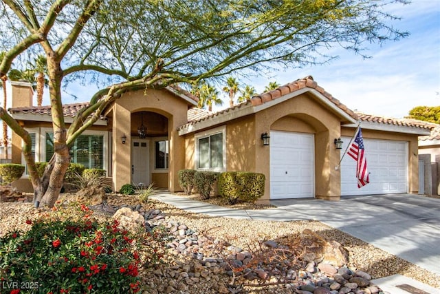 mediterranean / spanish-style home featuring a garage