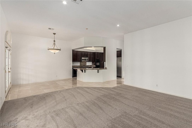 unfurnished living room with light carpet