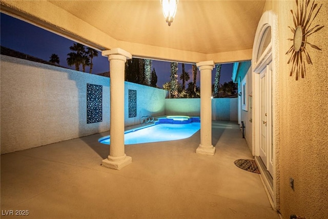 exterior space featuring a pool with hot tub