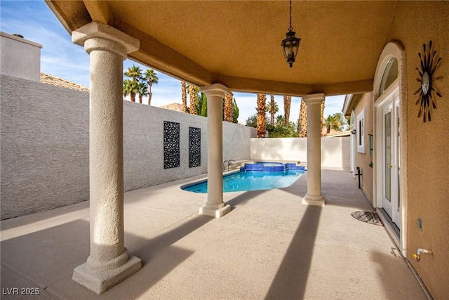 view of swimming pool featuring a patio area