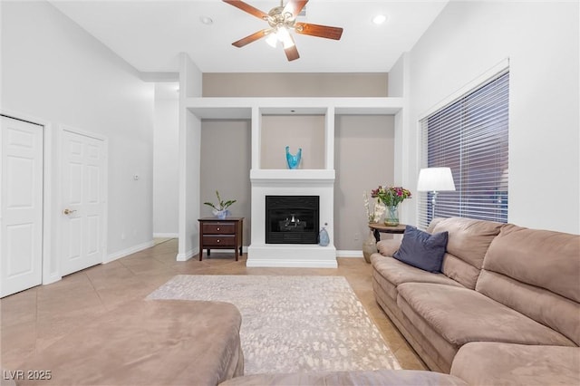 tiled living room featuring ceiling fan