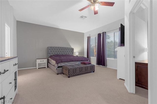 bedroom with light colored carpet and ceiling fan