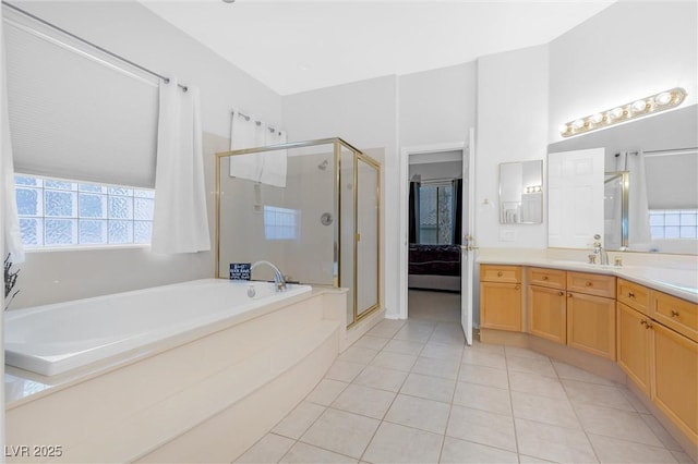 bathroom featuring vanity, tile patterned floors, and separate shower and tub