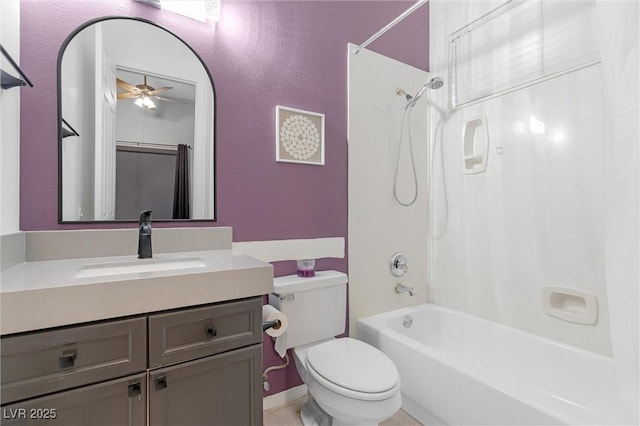 full bathroom with shower / tub combo with curtain, vanity, toilet, and ceiling fan