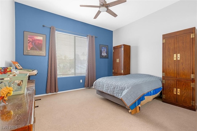 bedroom with ceiling fan and carpet floors