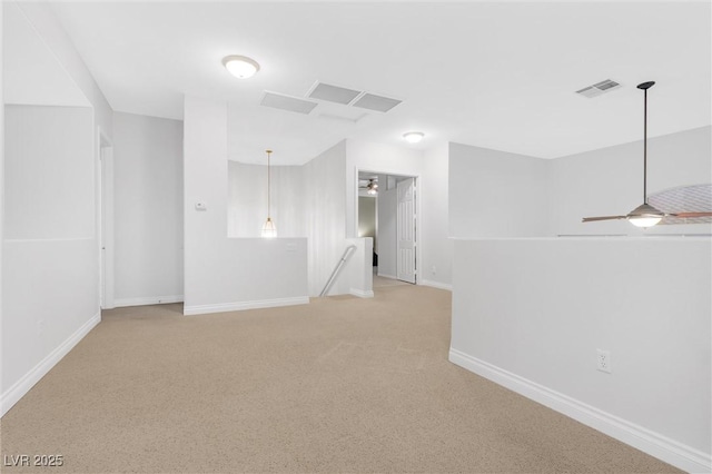 spare room featuring ceiling fan and carpet