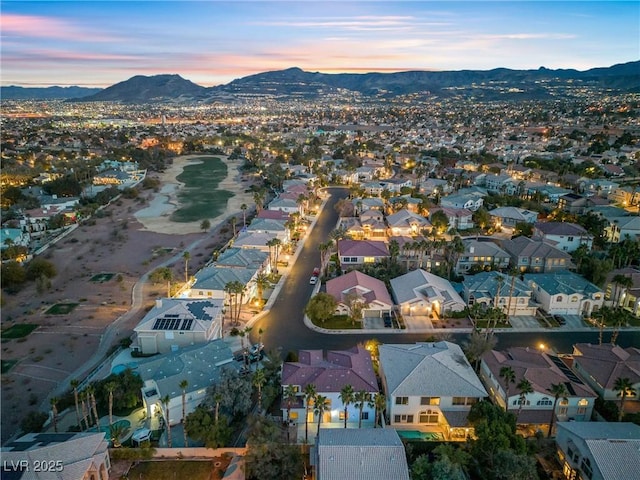 aerial view at dusk with a mountain view