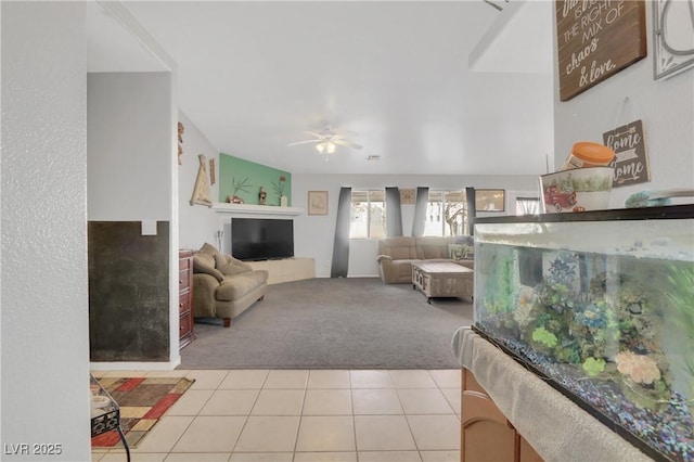 living room with ceiling fan and light colored carpet