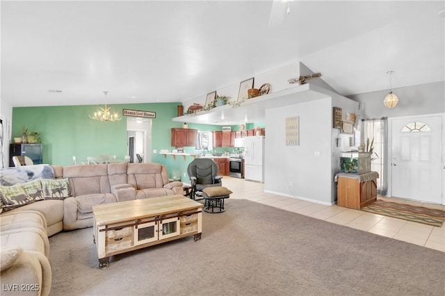 carpeted living room featuring lofted ceiling, sink, and a chandelier